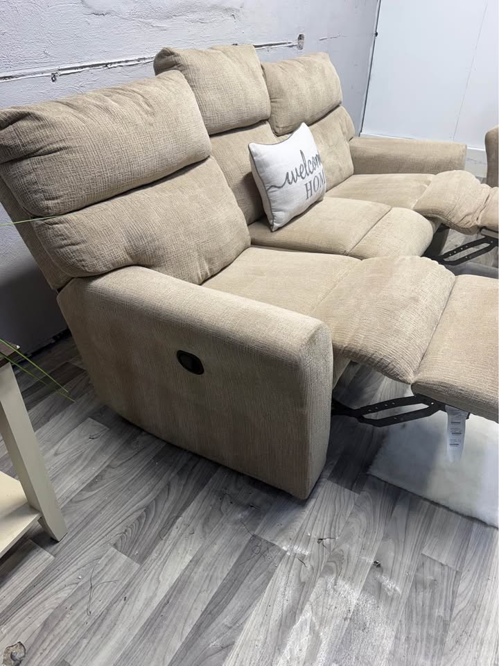 Ashley Furniture Tan Manual Reclining Couch And Loveseat