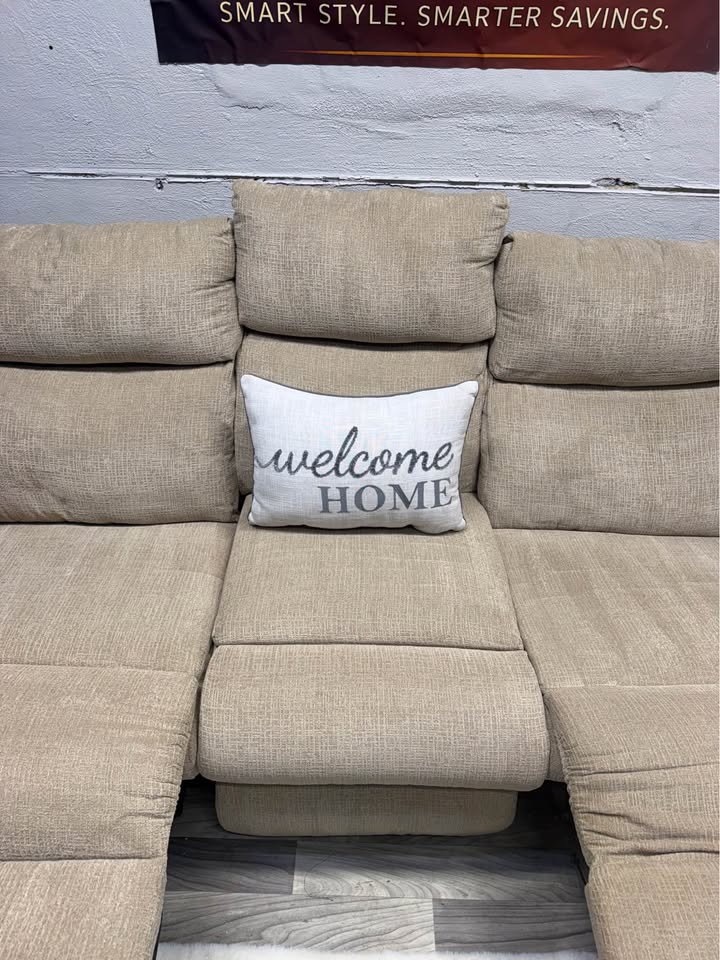 Ashley Furniture Tan Manual Reclining Couch And Loveseat