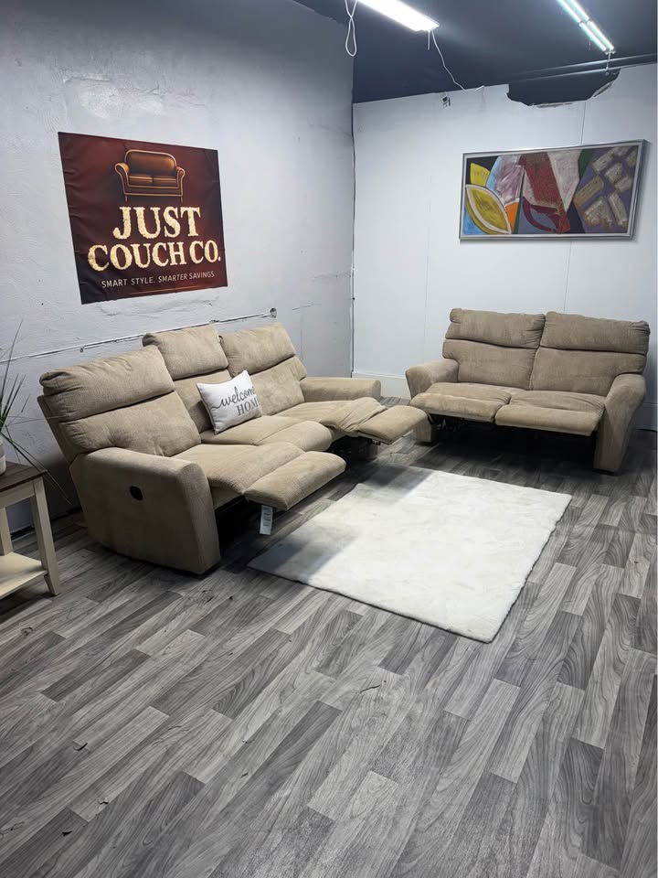 Ashley Furniture Tan Manual Reclining Couch And Loveseat