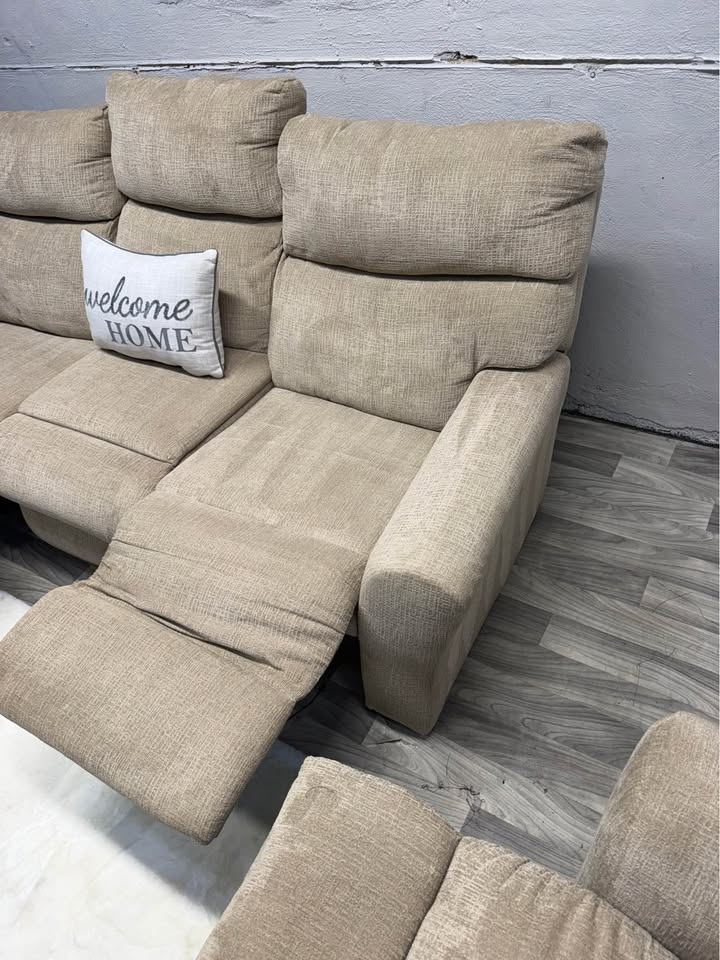 Ashley Furniture Tan Manual Reclining Couch And Loveseat