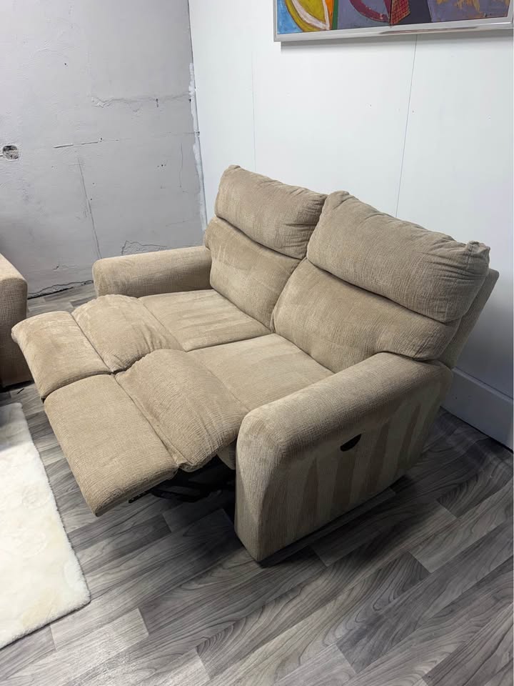 Ashley Furniture Tan Manual Reclining Couch And Loveseat