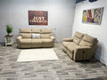 Ashley Furniture Tan Manual Reclining Couch And Loveseat
