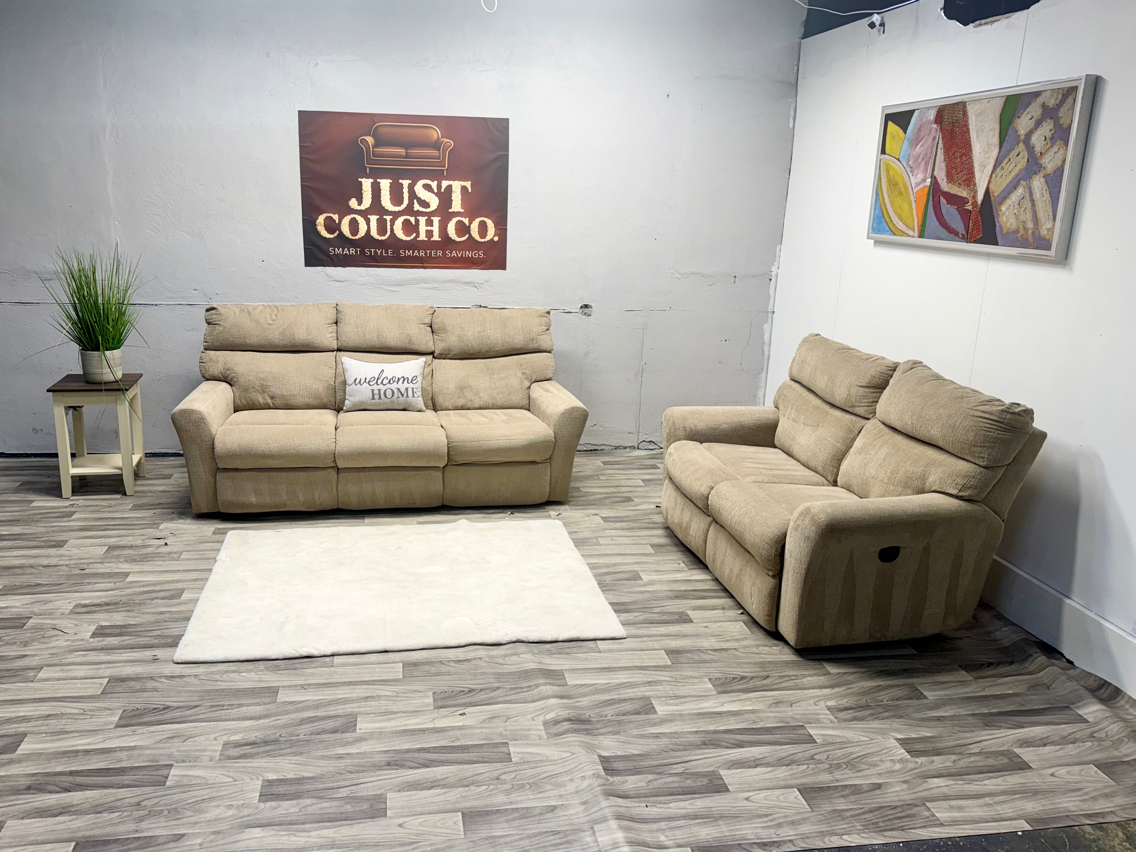 Ashley Furniture Tan Manual Reclining Couch And Loveseat