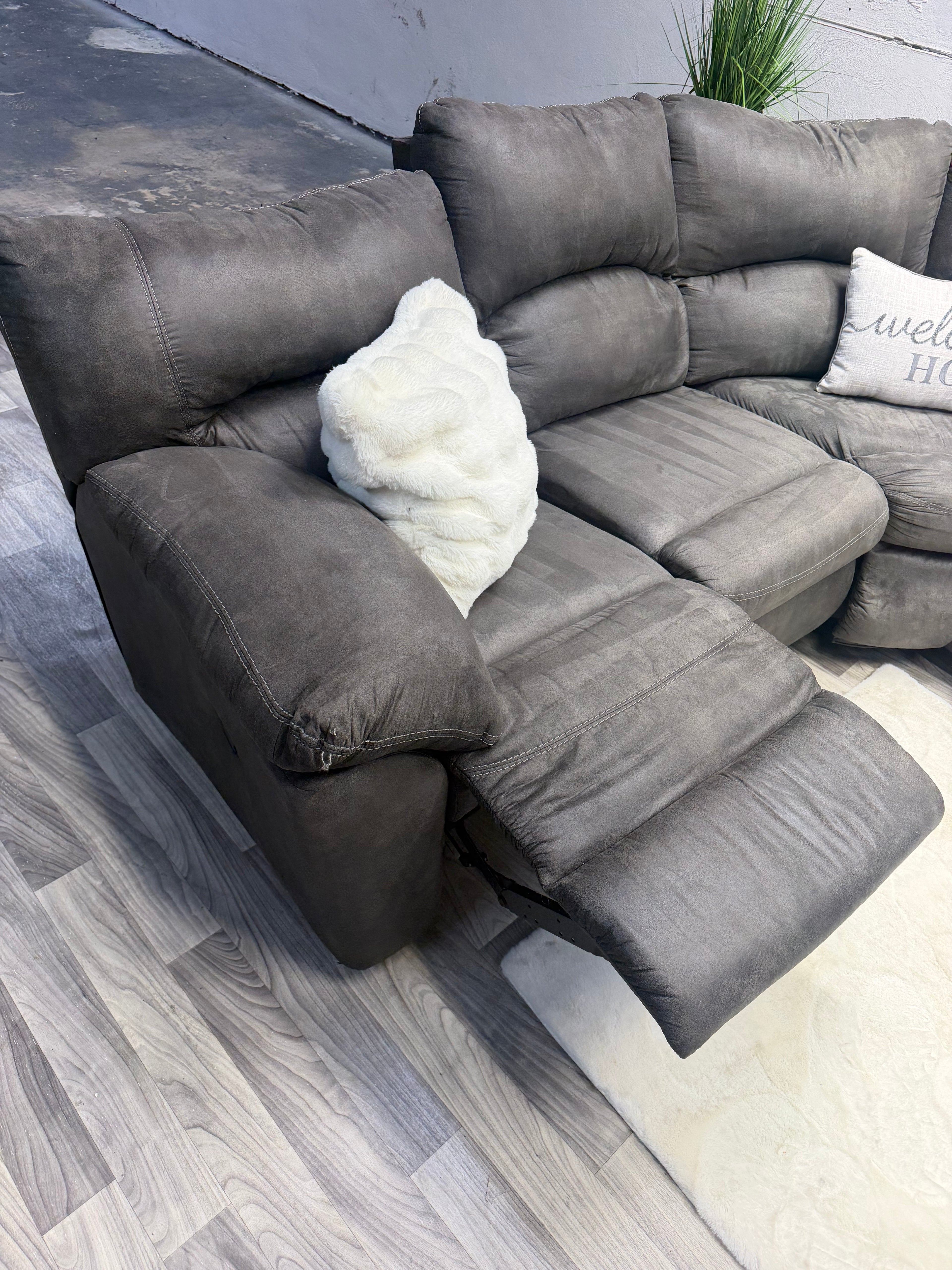Ashley Furniture Tamboo Gray Reclining Sectional Couch